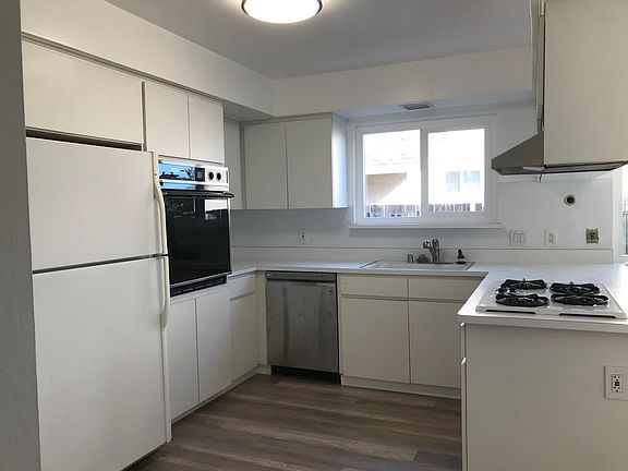 Kitchen with gas stove and new dishwasher