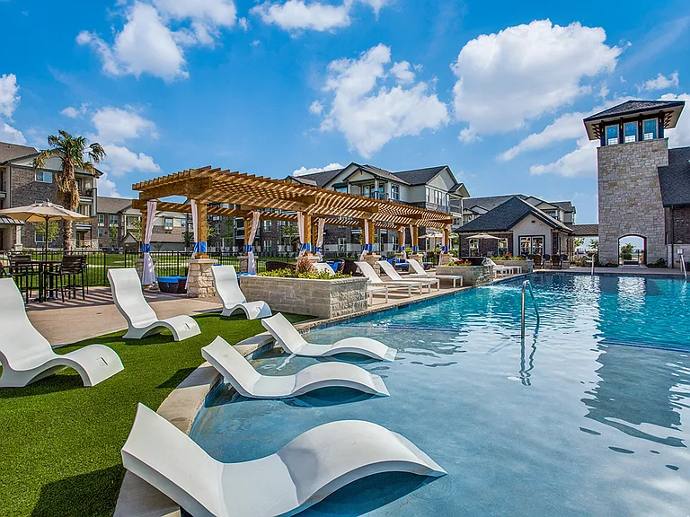 Resort-style Swimming Pool with Sunning Ledge and Beach Entry