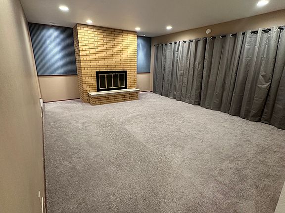 Living room with deck and views of Mt. Rainier