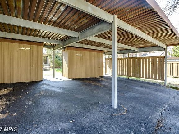 Covered parking with storage shed