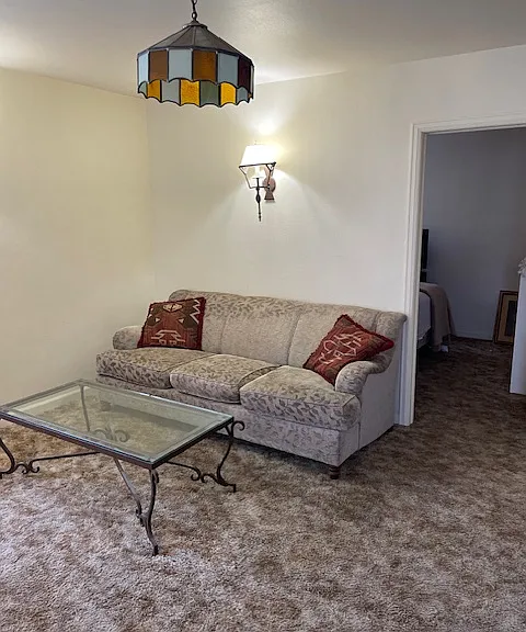 Living area with bedroom door to the right