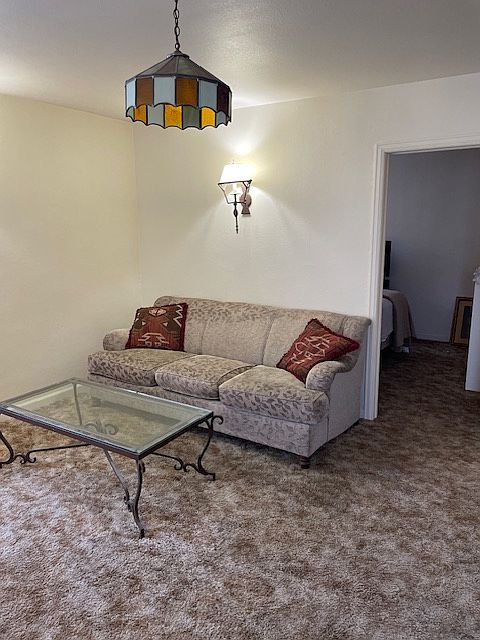 Living area with bedroom door to the right