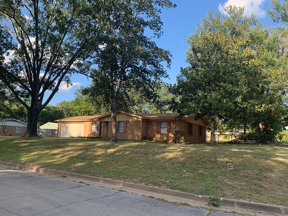 Street View of Home - Corner Lot with approximately 1/3 acre, with large fenced back yard. 2-car garage remote door lift.