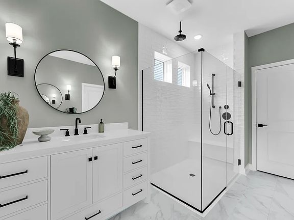 Primary bath with glass shower enclosure