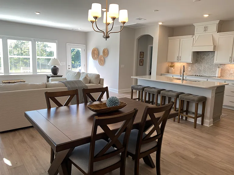 Dining room table has hidden sleeve to expand and seat 6.