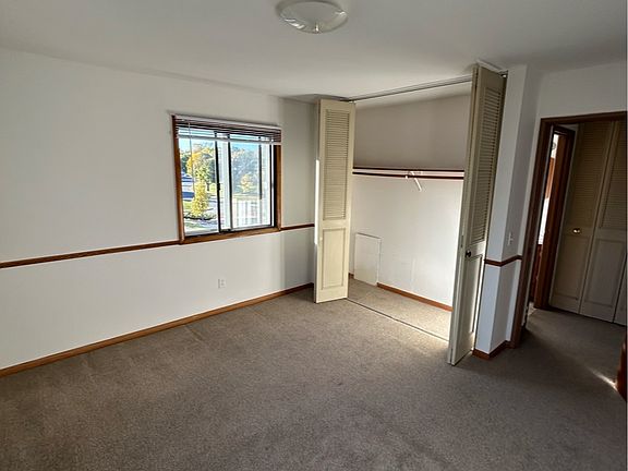 bedroom with closet open