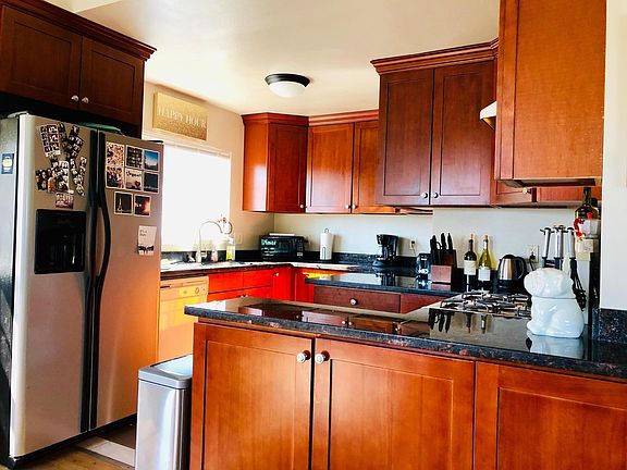 Spacious granite kitchen with stainless steel appliances