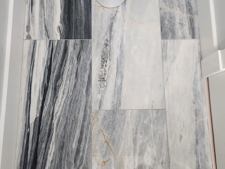 All three bathrooms's floors have this marble tile. I have no words to describe how captivating these are in person. Come see for yourself!