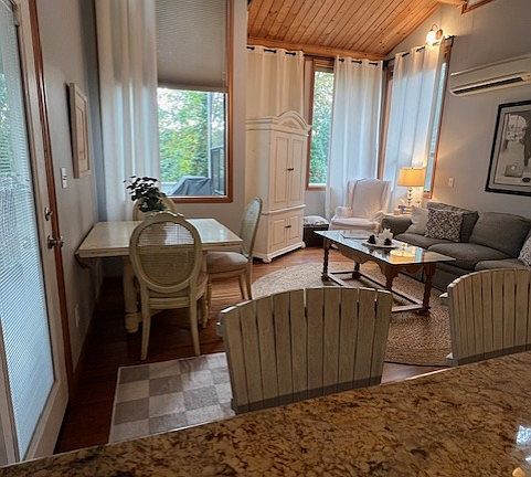 As you cook, look in to the living room from over the kitchen stove top while enjoying the spaciousness of pristine granite countertops.