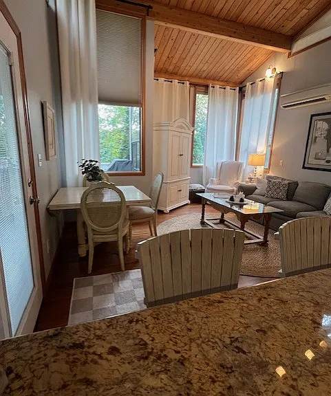 As you cook, look in to the living room from over the kitchen stove top while enjoying the spaciousness of pristine granite countertops.
