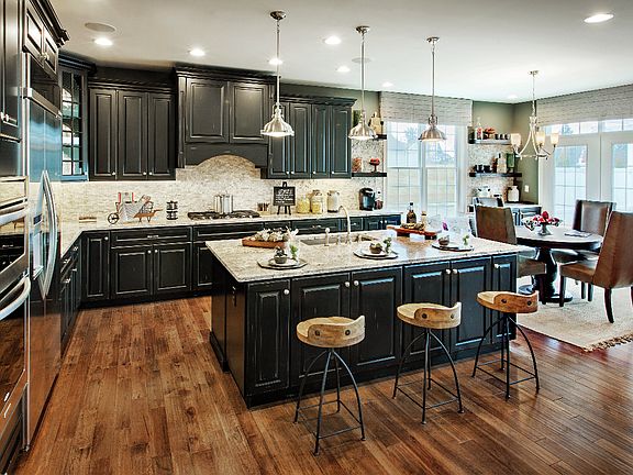 Well-Designed Kitchen with Center Island Overlooking Great Room