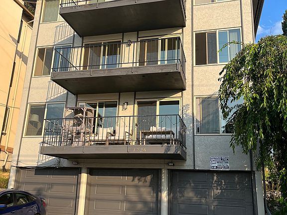 Apartment unit is the middle balcony. Optional garage/storage room on ground level.