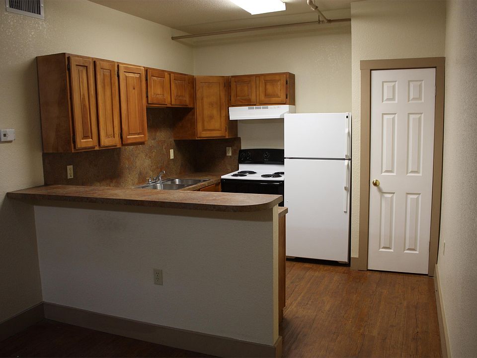 Open concept kitchen overlooking dining/living room.