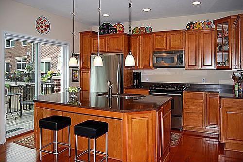 Gourmet kitchen leading to large deck