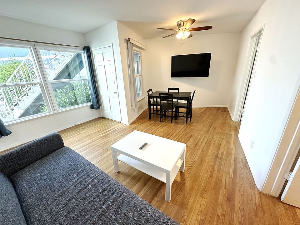 11089 STRATHMORE DRIVE - Westwood, CA 90024 - Living Room & Dining Area w/ Flatscreen TV