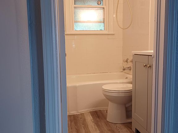 New flooring, vanity and toilet.