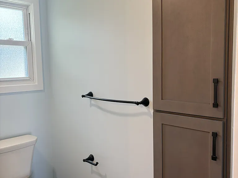 Built in linen closet and toilet