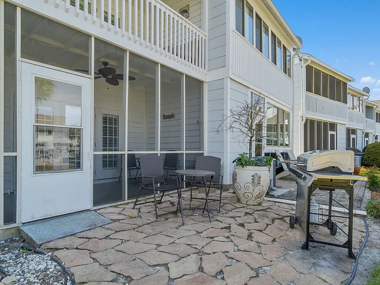 Grill and outdoor table and chairs are provided for guests