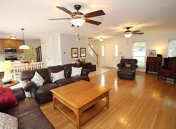Open floor plan living with hardwood floors and beautiful light fixtures...great for entertaining!