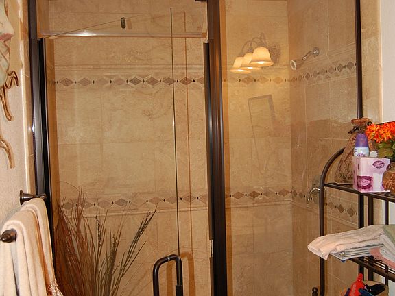 enclosed travertine shower