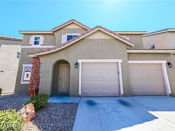 Warm exterior colors and stone accents add to the charm and curb appeal of this home