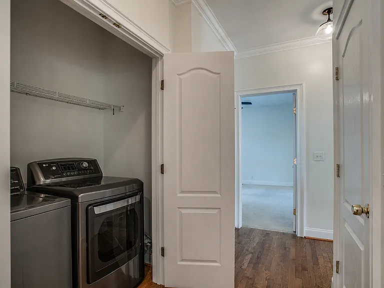 Full size washer and dryer in kitchen.