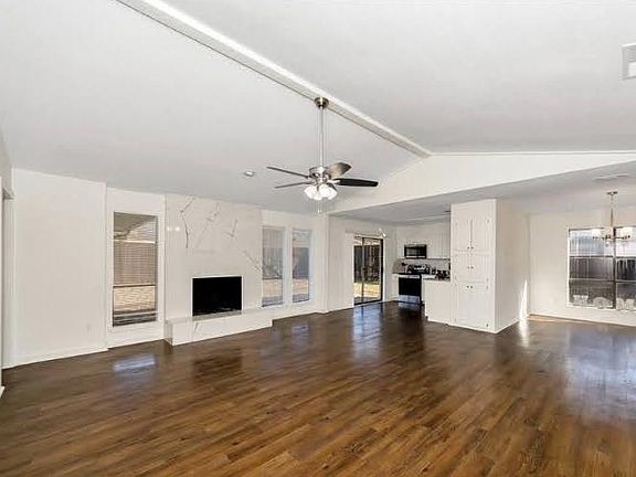 Open concept house with high ceiling in living area