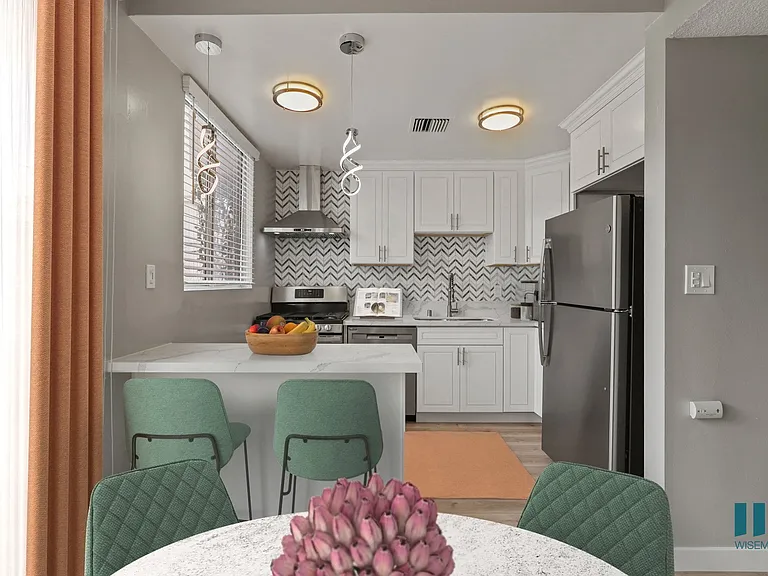 Open-Concept Kitchen with Countertop Bar and Dining Area