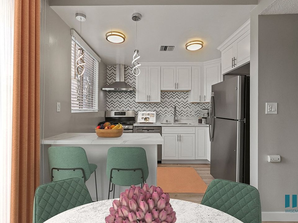 Open-Concept Kitchen with Countertop Bar and Dining Area