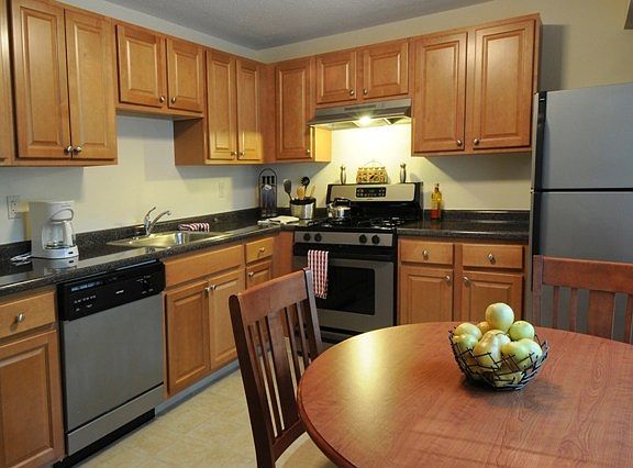 Clean Steel Appliances and Wood Cabinetry