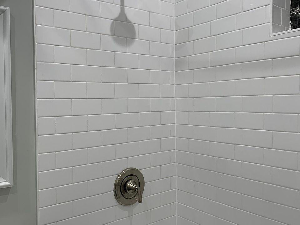 Extra high shower head and curved curtain rod installed!