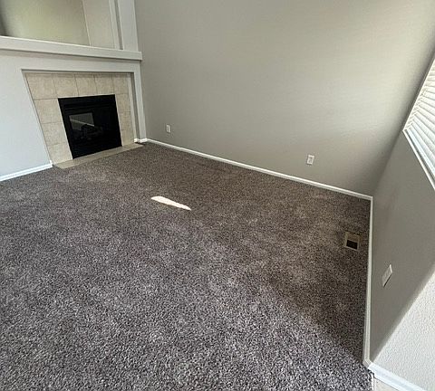 entry into living room with gas fireplace
