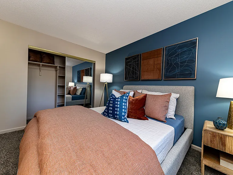 Cozy bedroom with carpet and generous closet space