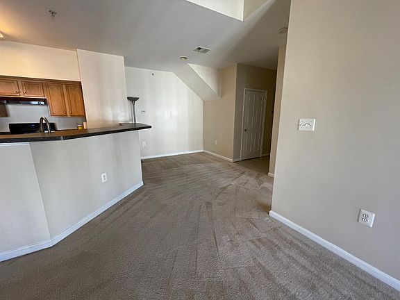 Living Room - View of Kitchen and Dining