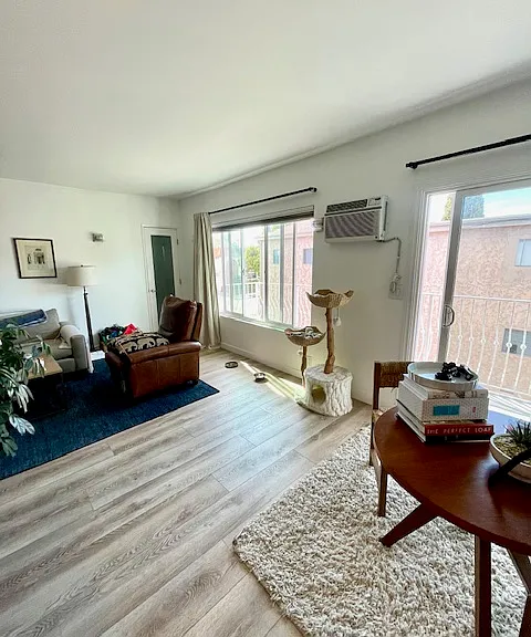 Living room with sliding doors to large balcony