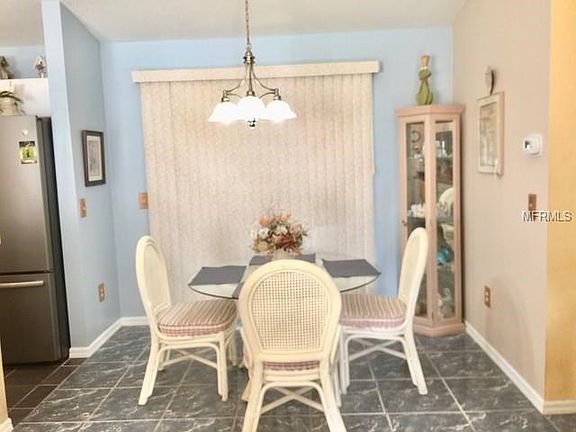 Dining area has sliding doors that open to the lanai