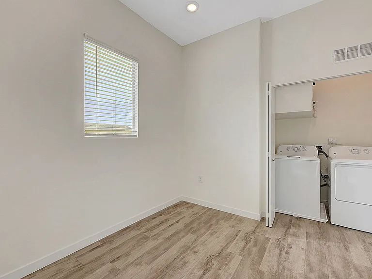 Experience the convenience of a stylish in-home laundry area, bathed in natural light.