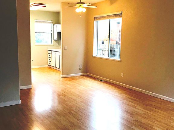 Dining area, kitchen beyond