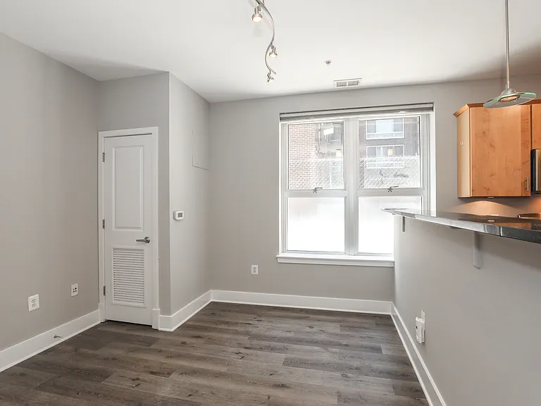 Sunny Living Area with Large Windows in Northwest DC Apartment