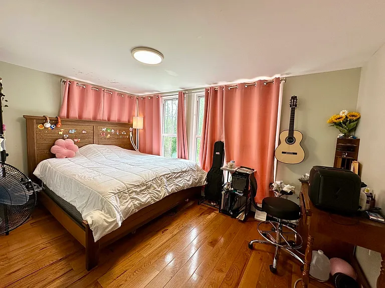 Large bedroom with hardwood