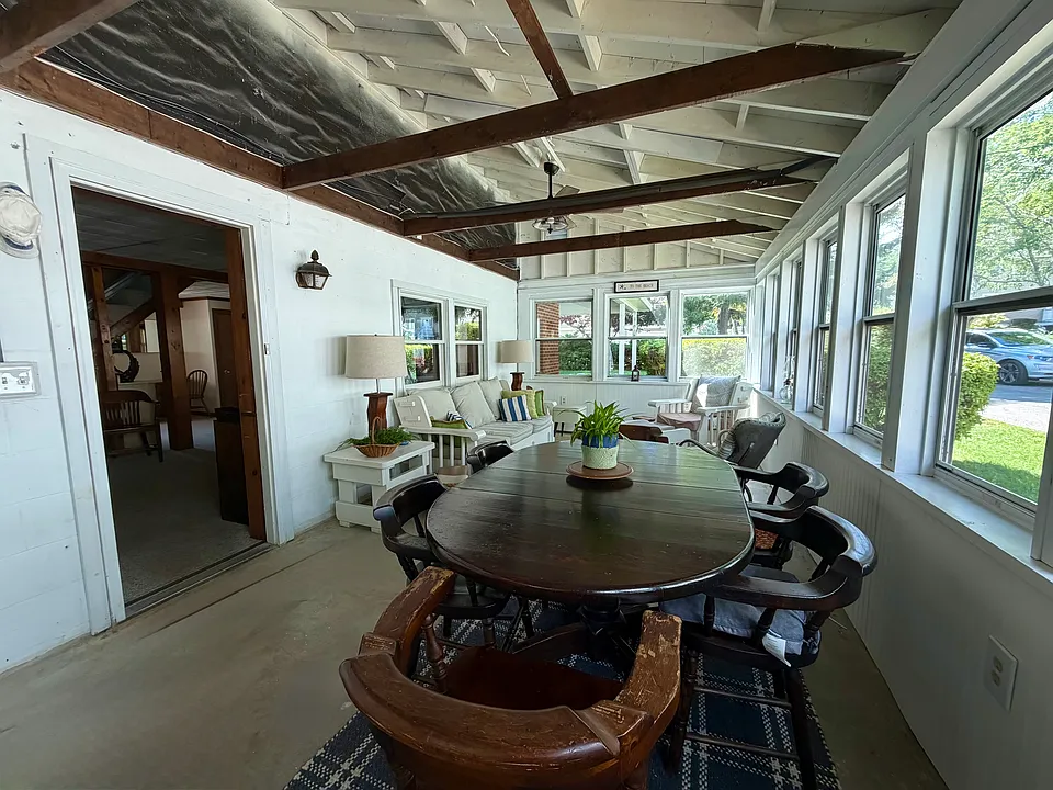 Three season porch with dining and sitting area