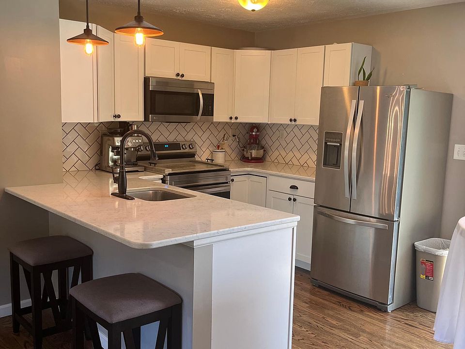 updated kitchen with 4 year old stainless steel appliances and eat in breakfast bar, kitchen does include an eat in space but the space is smaller but big enough for a 2-4 top table