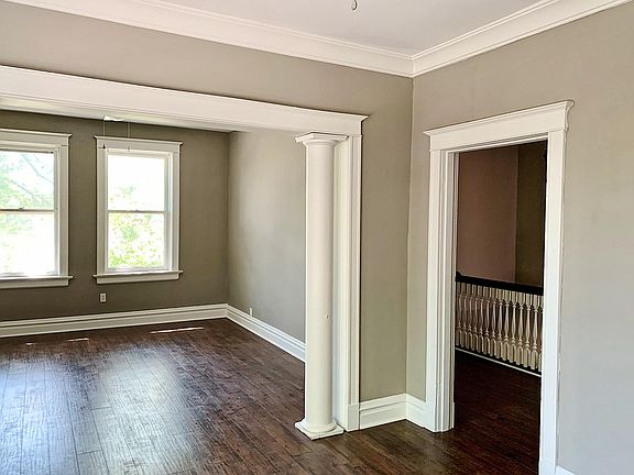 Dining area looking into living room and entry foyer