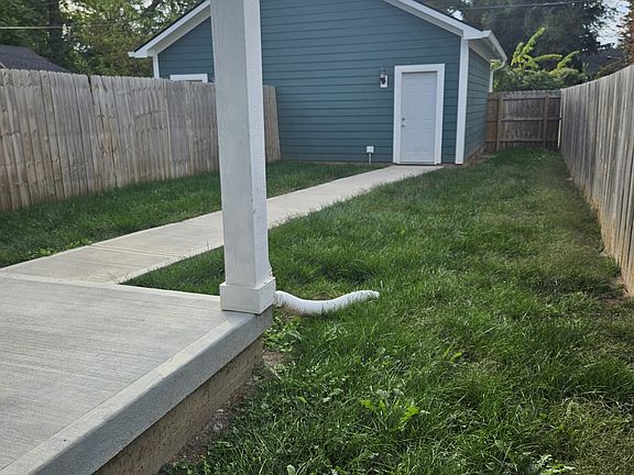 Full privacy fenced yard with walkway to 1 car garage. Each garage space is separate, with own automatic garage opener and door.
