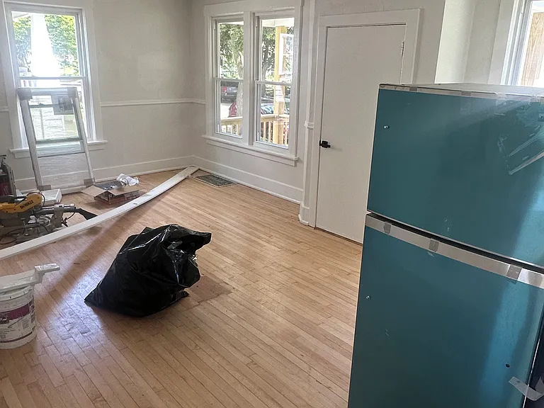(disregard the fridge in the middle of the room) open concept kitchen, living, and dining rooms.