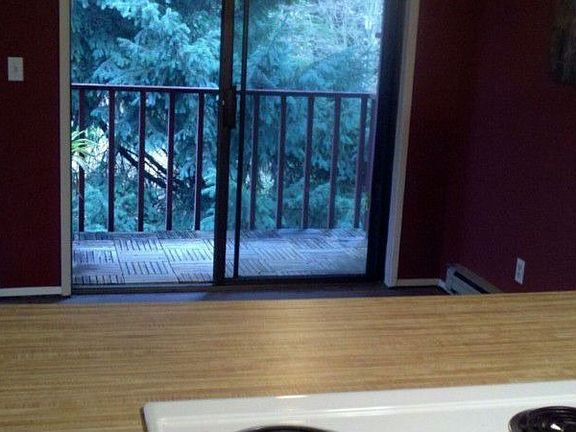 The kitchen is open to the dining room. Just off the dining room is a private feeling deck.