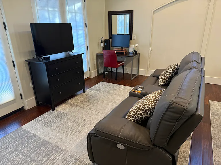 Reclining love seat facing TV
