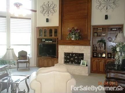 Living/Great Room
						:
						Custom woodwork, stone fireplace, 15 ft. ceiling