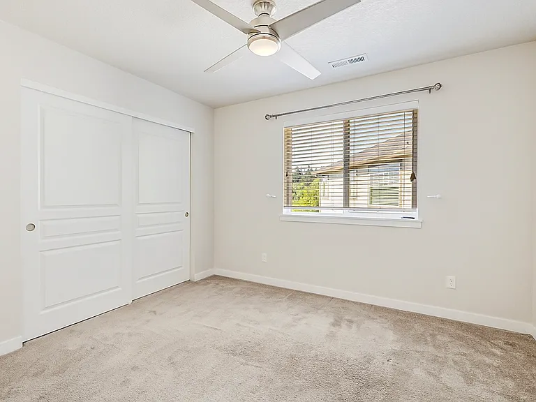 Bedroom 2 with remote controlled fan.