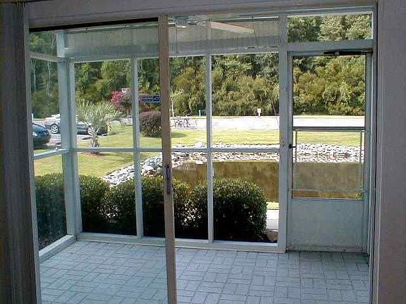 Screened porch overlooks lake